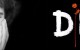 Susan Boyle's face, looking dreamy, next to DM logo with rose.